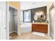 Primary bathroom featuring double sinks, shower, soaking tub, and neutral tile flooring at 37438 Picketts Mill Ave, Zephyrhills, FL 33542