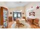 Elegant dining room featuring hardwood floors, a round table, and decorative accents at 37438 Picketts Mill Ave, Zephyrhills, FL 33542