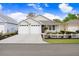 Charming single-Gathering home with a well-manicured lawn, two-car garage, and inviting front porch at 37438 Picketts Mill Ave, Zephyrhills, FL 33542