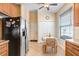 Bright eat-in kitchen area featuring tile flooring, a breakfast table, and ample storage at 37438 Picketts Mill Ave, Zephyrhills, FL 33542