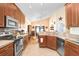 Well-appointed kitchen with wood cabinets, stainless steel appliances, and ample counter space at 37438 Picketts Mill Ave, Zephyrhills, FL 33542