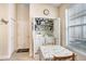 Bright laundry room with in-unit washer and dryer and ample shelving for storage, plus natural light at 37438 Picketts Mill Ave, Zephyrhills, FL 33542
