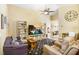 Bright living room with tall ceilings, stylish decor, and comfortable seating arrangement at 37438 Picketts Mill Ave, Zephyrhills, FL 33542