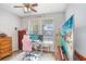 Bright office space offers dual monitors, a pink chair, and natural light for productivity at 37438 Picketts Mill Ave, Zephyrhills, FL 33542