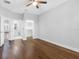 Bedroom featuring wood floors and access to a bathroom and a walk-in closet at 410 S Church Ave, Tampa, FL 33609