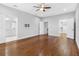 Bedroom featuring wood floors and access to a walk-in closet and bathroom at 410 S Church Ave, Tampa, FL 33609