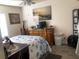 Bedroom with wood dresser and seashell-themed bedding, with unique art at 4794 Cobia Se Dr # D, St Petersburg, FL 33705