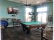 Game room features a pool table, poker table, and entertainment amenities at 4794 Cobia Se Dr # D, St Petersburg, FL 33705