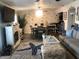 Inviting living room with a decorative fireplace, wood floors, and an adjacent dining area at 4794 Cobia Se Dr # D, St Petersburg, FL 33705
