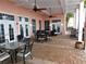 Charming covered patio with comfortable seating and outdoor dining space at 4794 Cobia Se Dr # D, St Petersburg, FL 33705