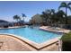 Community pool and spa with ocean views and lounge seating at 4794 Cobia Se Dr # D, St Petersburg, FL 33705