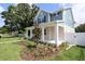 Inviting two-story home with a well-manicured front yard and craftsman-style details at 5235 9Th N Ave, St Petersburg, FL 33710