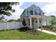 Charming two-story home with a covered porch and landscaped front yard at 5235 9Th N Ave, St Petersburg, FL 33710
