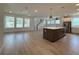 Open-concept kitchen with a large island, stainless steel appliances, and wood flooring at 5235 9Th N Ave, St Petersburg, FL 33710