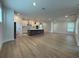 Bright and airy open-concept living space with wood floors and recessed lighting at 5235 9Th N Ave, St Petersburg, FL 33710