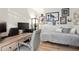 Bedroom with a modern desk setup, featuring neutral tones and wall art at 5279 Isla Key S Blvd # 212, St Petersburg, FL 33715