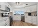 Updated kitchen boasting stainless steel appliances, white cabinets, and lovely views to the water at 5279 Isla Key S Blvd # 212, St Petersburg, FL 33715