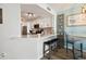 Remodeled kitchen with granite countertops, stainless appliances, and breakfast bar seating at 5279 Isla Key S Blvd # 212, St Petersburg, FL 33715
