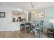 Cozy kitchen nook with white table, seating, and view into the renovated kitchen at 5279 Isla Key S Blvd # 212, St Petersburg, FL 33715