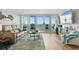Inviting living room featuring a comfortable sofa, large windows, and a stunning water view at 5279 Isla Key S Blvd # 212, St Petersburg, FL 33715