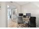 Office area with two computer monitors, a desk, and mirrored closet doors at 5279 Isla Key S Blvd # 212, St Petersburg, FL 33715