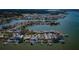 Stunning aerial view of waterfront homes with private docks in a coastal community near the ocean at 5434 Oakhurst Dr, Seminole, FL 33772