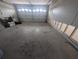 Spacious garage with ample storage and a roll-up door is undergoing renovation at 5434 Oakhurst Dr, Seminole, FL 33772