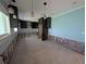 Kitchen featuring dark cabinetry, stone backsplash, and modern pendant lighting at 5434 Oakhurst Dr, Seminole, FL 33772