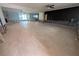 Vast living area with an open layout, modern lighting, and sliding door access at 5434 Oakhurst Dr, Seminole, FL 33772