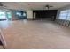 Spacious living room with tile flooring and sliding glass doors to the outside at 5434 Oakhurst Dr, Seminole, FL 33772