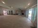 Open living space with recessed lighting, fireplace, and access to outdoor patio at 5434 Oakhurst Dr, Seminole, FL 33772
