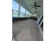 Sunroom with waterfront views, tiled floors, and large windows at 5434 Oakhurst Dr, Seminole, FL 33772