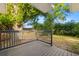Enjoy outdoor relaxation on the wooden back deck surrounded by lush greenery and mature trees at 5809 Dartmouth N Ave, St Petersburg, FL 33710