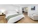 Bright bedroom with hardwood floors, and views into the dining room and kitchen at 5809 Dartmouth N Ave, St Petersburg, FL 33710