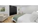 Comfortable bedroom features a large closet, a cozy chair, and ample natural light at 5809 Dartmouth N Ave, St Petersburg, FL 33710