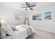 Tranquil bedroom with a ceiling fan, neutral decor, and plenty of natural light at 5809 Dartmouth N Ave, St Petersburg, FL 33710