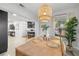 Cozy dining room features a decorative light fixture, stylish decor, and ample space for entertaining at 5809 Dartmouth N Ave, St Petersburg, FL 33710