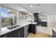 Bright, open kitchen featuring stainless steel appliances, a coffee bar, and a large window at 5809 Dartmouth N Ave, St Petersburg, FL 33710