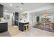 Modern kitchen with island, dining area and stainless steel appliances at 5809 Dartmouth N Ave, St Petersburg, FL 33710