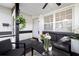 Inviting front porch with neutral furniture and decorative plants at 5809 Dartmouth N Ave, St Petersburg, FL 33710