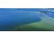 Expansive aerial view of the coastline featuring the clear blue waters of the Gulf and a small island at 706 Bunker View Dr, Apollo Beach, FL 33572