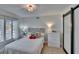 Cozy bedroom with natural light, a barn door closet, and stylish decor at 706 Bunker View Dr, Apollo Beach, FL 33572