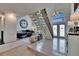 Home's entryway features high ceilings, tiled floors, and an adjacent office space at 706 Bunker View Dr, Apollo Beach, FL 33572