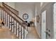 Bright foyer with staircase, high ceilings, tile flooring, and a view of the living area, creating an inviting entrance at 706 Bunker View Dr, Apollo Beach, FL 33572