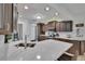 Well-lit kitchen features a breakfast bar, modern appliances, and plenty of cabinet storage at 706 Bunker View Dr, Apollo Beach, FL 33572
