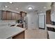 Stylish kitchen with stainless steel appliances, white countertops, and dark wood cabinetry at 706 Bunker View Dr, Apollo Beach, FL 33572