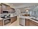 The kitchen features modern appliances and countertops, with an open layout to the dining area at 706 Bunker View Dr, Apollo Beach, FL 33572