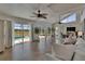 Open-concept living room with vaulted ceiling and views of screened lanai at 706 Bunker View Dr, Apollo Beach, FL 33572