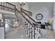 Spacious living area with high ceilings, a staircase, and access to the outdoor patio at 706 Bunker View Dr, Apollo Beach, FL 33572