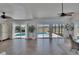 Bright living room with tile floors, pool views, and sliding glass doors at 706 Bunker View Dr, Apollo Beach, FL 33572